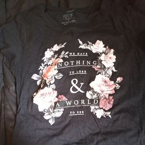 L black graphic tee shirt from the company freeze